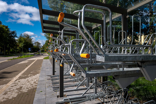 Modern Two-Tier Bicycle Parking Station Beside an Urban Cycle Path