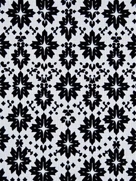 Geometric black and white Kufiya pattern on a traditional Arabian fabric, symmetry, tribal