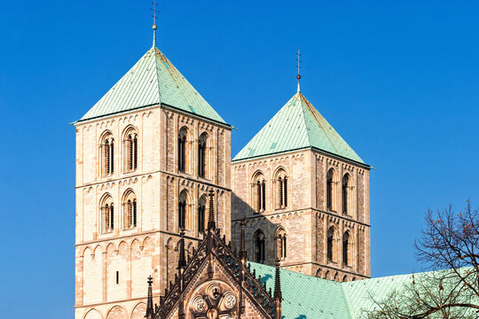Iconic twin Romanesque towers of St. Paulus Cathedral rise above the historic center of M&uuml;nster in Germany
