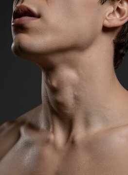 Captures Close Profile Of Individuals Neck Jawline Against Dark Background Person Young With Smooth Skin Natural Contours Muscles Adam