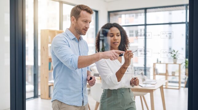 Office workers planning with digital glass board