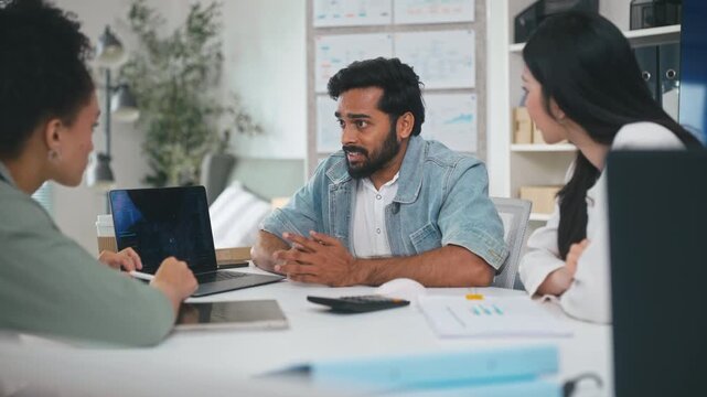 Business team discussing strategy during a meeting with AI assistant technology.