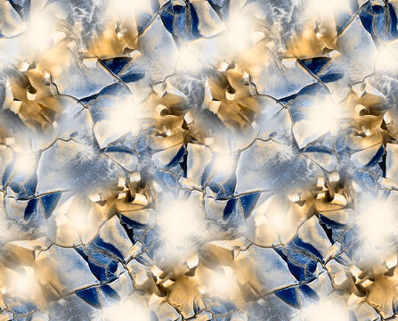 Seamless abstract pattern featuring cracked marble and rock textures in shades of royal blue, warm gold, grey, and soft cream highlights.