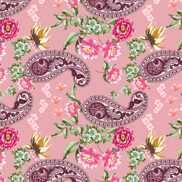 Seamless paisley pattern featuring ornate maroon paisley motifs surrounded by bright pink blossoms and light blue flowers on a soft pink background.