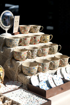 Handmade ceramic cups with floral patterns