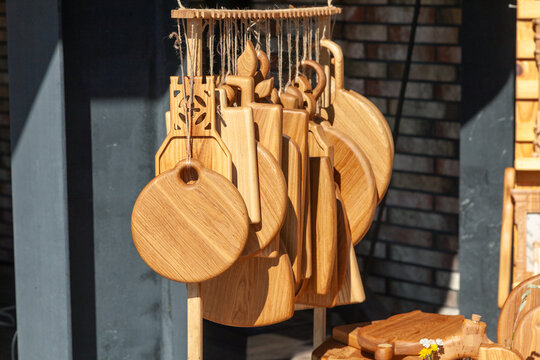 Wooden cutting boards hanging at craft fair