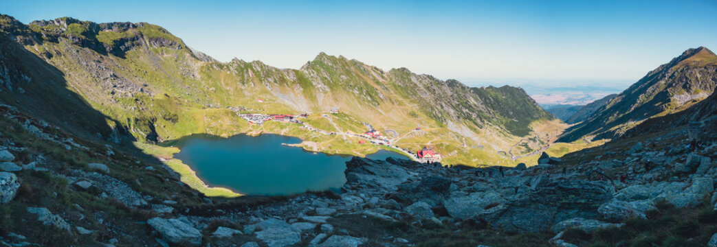 Panoramic view of a mountain lake Balea and chalets in Fagaras