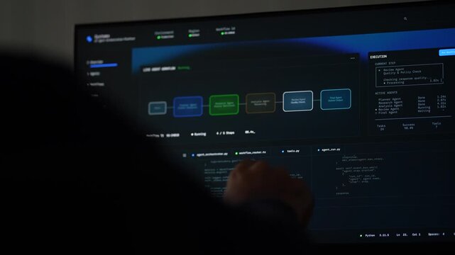 A silhouetted hand in the foreground points at a monitor where an agent workflow diagram runs beside live execution output and source code in a dark tech office.