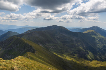 Fototapeta premium Massive rounded mountain peak under a dramatic cloudy sky