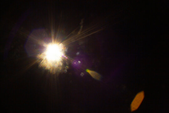 Sun flare on the black background