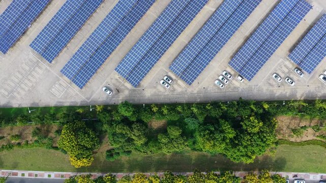 Top down view of solar carport rows and a landscaped parking edge