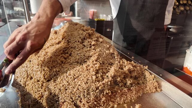 Large pile of rice being served at a street market