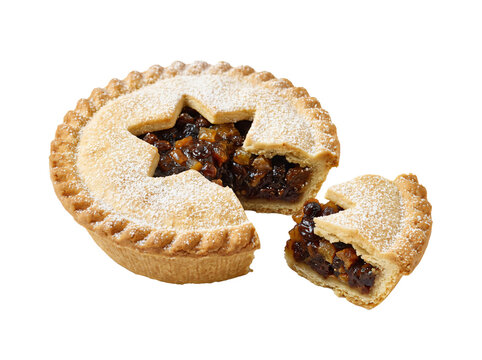 Traditional golden brown mince pie featuring a star cutout and delicious fruit filling dusted with powdered sugar on transparent background