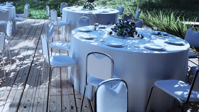Tables are arranged for an event outside. Each table has a round cover and flowers in the center. Chairs are placed around the tables. Sunlight creates patterns on the surface.