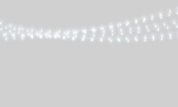String lights suspended against a dark background create an ambient glowing effect. The cool white bulbs emit a soft, dispersed light with slight halos around each lamp.