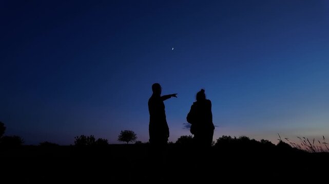 Amateur astronomers enjoying night sky with stars, planets, Moon eclipse and other celestial objects.