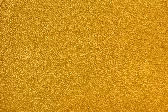Mustard yellow faux leather texture background