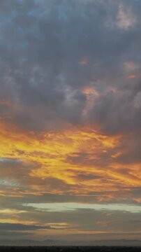 Golden sunrise over Mae rim district, Chiang Mai, Thailand spreads warm light across foggy suburbs.