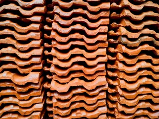 red roof tiles background, tiles stacked on top of each other. abstract background © Vignesh