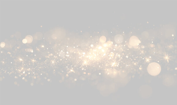 Golden glitter particles scatter across a dark background with bright sparkling light points. The soft bokeh effect creates a dreamy glowing atmosphere ideal for festive themes.
