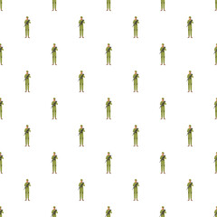 Obraz premium Repeating pattern of soldiers standing in green uniform with rifles