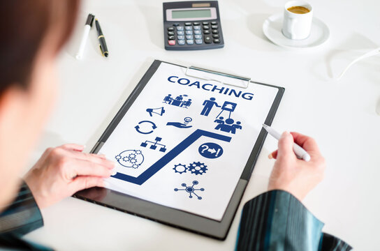 Coaching concept on a clipboard