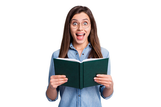 Photo of surprised brunette young woman hold book library amazed information isolated on grey color background