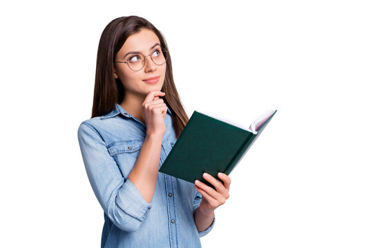 Photo of nice sweet long brunette girl hand chin look empty space hold copybook wear spectacles blue cloth isolated on grey background