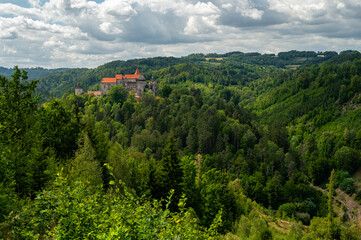 Beautiful old castle in forests with autumn landscape.Beautiful autumn landscape with colorful nature in the Czech Republic in autumn time..Pernstejn - Nedvedice © montypeter