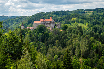 Beautiful old castle in forests with autumn landscape.Beautiful autumn landscape with colorful nature in the Czech Republic in autumn time..Pernstejn - Nedvedice © montypeter