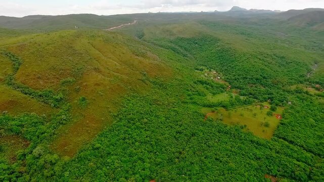 Spectacular aerial view of the verdant forest and moorland in the Vally do Segredo, traversed by the Sao Miguel river in Goias, Brazil