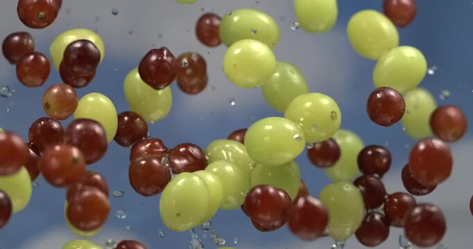 Grapes with leaves and water splashes floating in the air in super slow motion