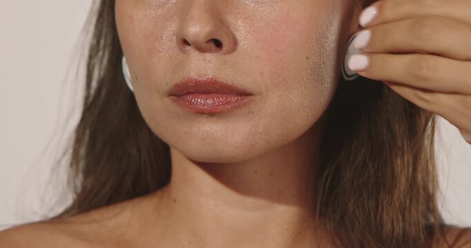 Close up of a woman wearing hand colored paper lips over her mouth with copy space. Concept creative fashion, beauty advertising, craft branding and editorial design.