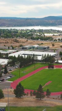 Drone pulls back revealing track and softball fields, Klamath Falls, Oregon
