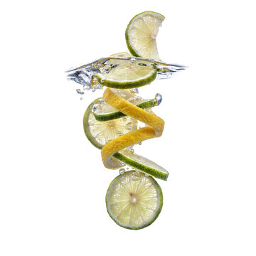 Fresh lime and lemon slices falling into clear water with bubbles and a citrus peel spiral isolated on a transparent background