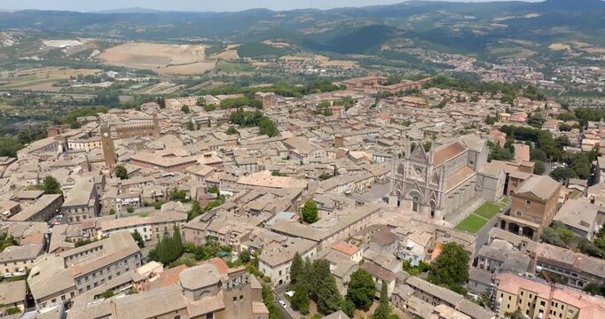 Aerial panorama of Orvieto's historic center with Torre del Moro and Orvieto Cathedral in the distance. It's a small town in province of Terni, Umbria, Central Italy.