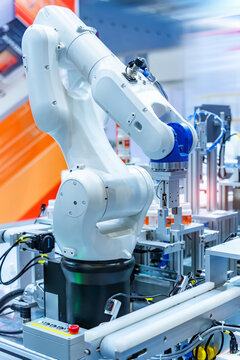 automatic robot arm machine tool in industrial manufacture factory,Smart factory industry 4.0 concept.
