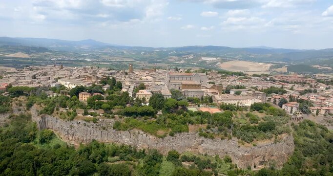 Aerial panorama of the historic hilltop town of Orvieto perched on a volcanic tuff cliff, with medieval walls, located in province of Terni, Umbria, Italy.