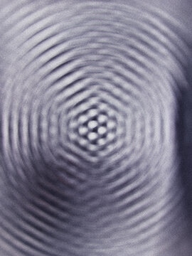 Abstract ripple pattern with a central hexagonal geometric structure