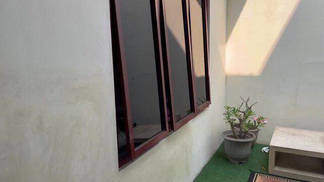Cozy home exterior corner with natural sunbeams