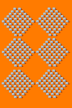 A repeating pattern features digital cameras on an orange background