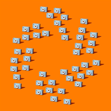 Blue cameras form an aperture pattern on an orange background