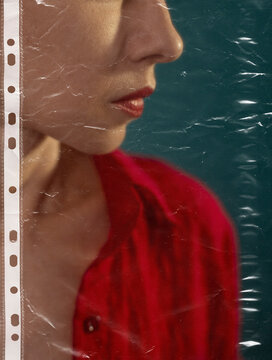 A woman stands behind a plastic film representing suffocation