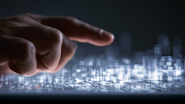 A close-up of a hand pointing towards a digital interface with luminous data points. The image symbolizes interaction with technology, data visualization, and modern innovation.