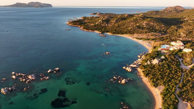 Aerial panoramic view of Costa Smeralda coastline at sunset in Sardinia, Italy