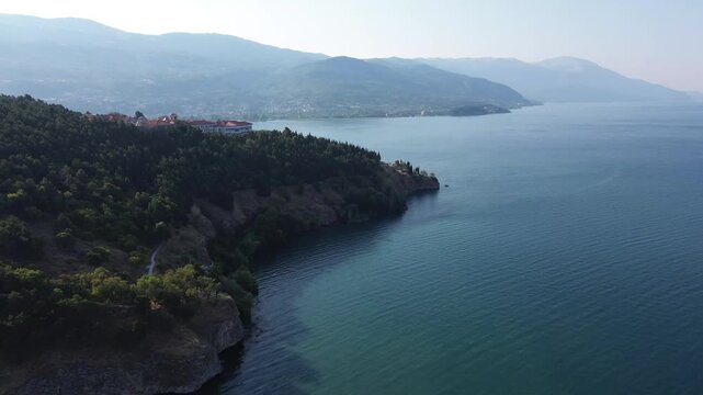 Bird eye aerial view of the Bay of Bones stilt village museum on Lake Ohrid, North Macedonia