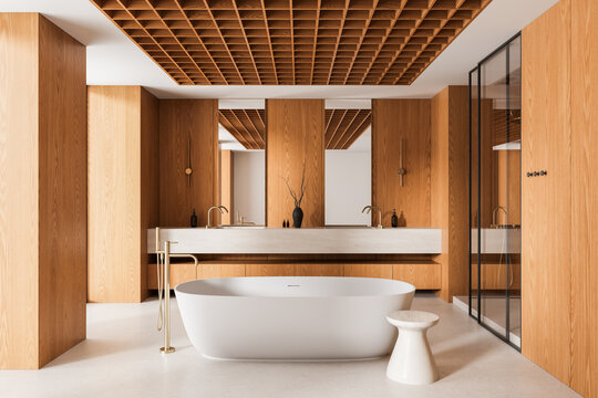 Contemporary wood paneled bathroom interior with freestanding bathtub, sculptural vanity, glass shower, and geometric slatted ceiling design. 3D Rendering