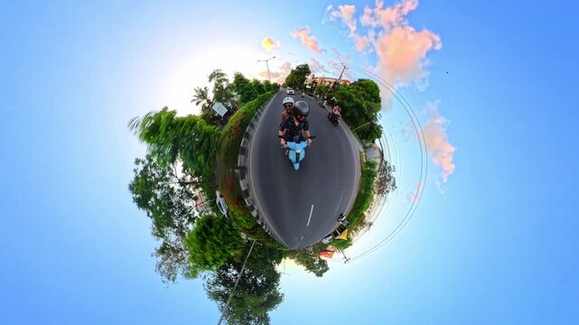 Creative tiny planet effect transforms a 360-degree video into a curved miniature world, showing a scooter rider on a tropical road surrounded by greenery.