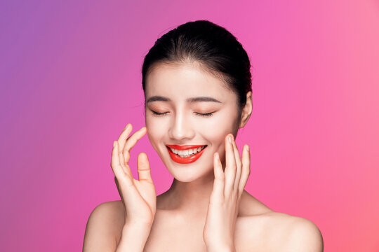Woman Smiling with Hands on Cheeks