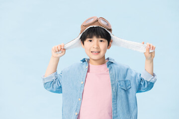 Boy Wearing Aviator Hat Smiling at Camera © CaoBaoTran